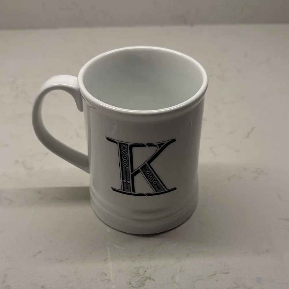 Schurman Retail Group “K” Initial White Monogrammed Mug with Black Lettering